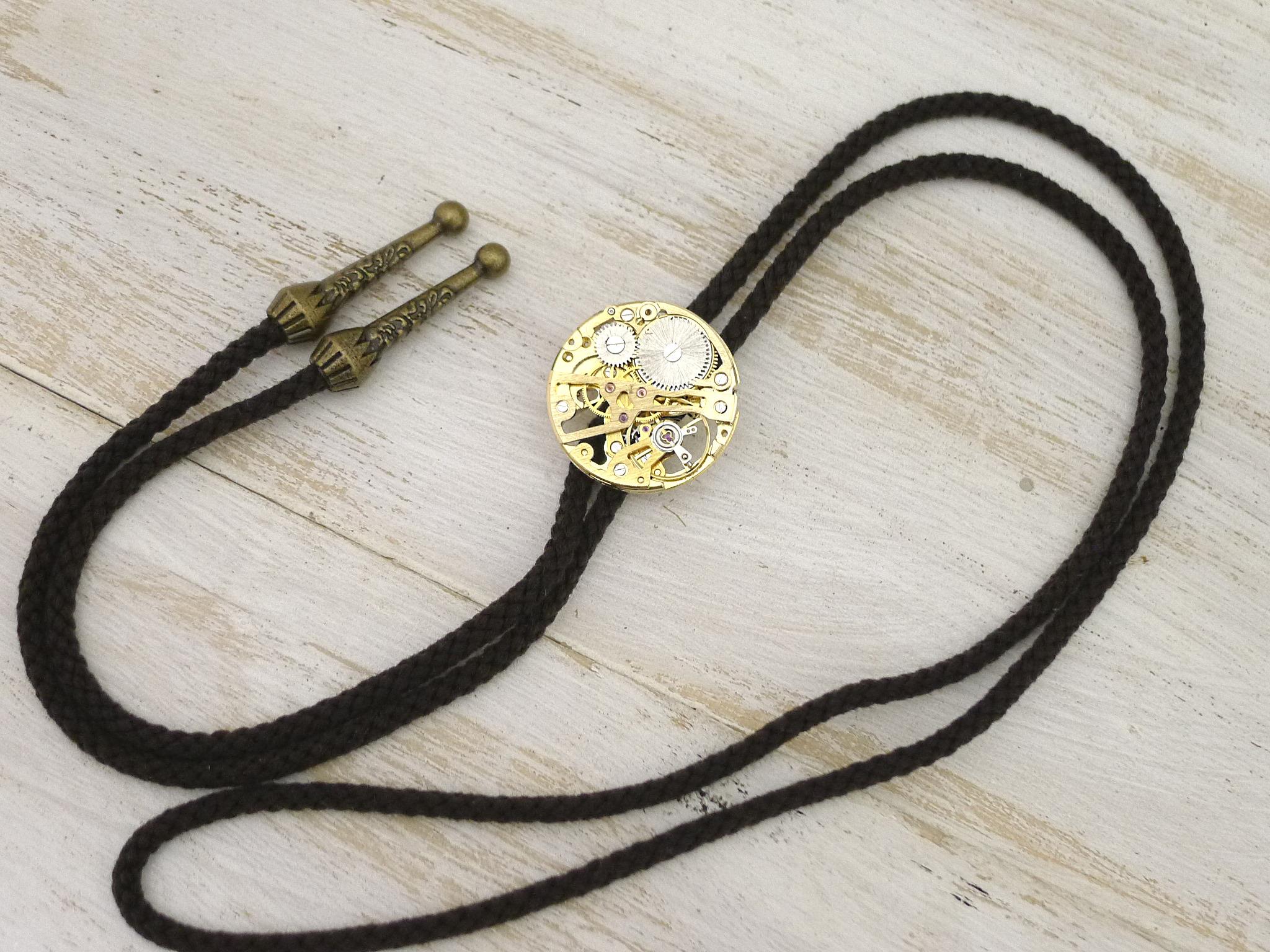 手巻き腕時計ムーブメント ループタイ ゴールドカラー1枚目の画像